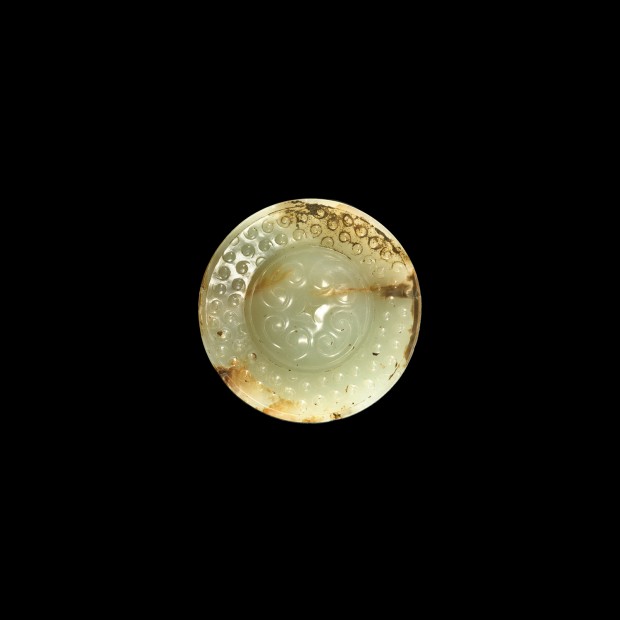 AN ARCHAIC JADE SWORD POMMEL (SHOU)